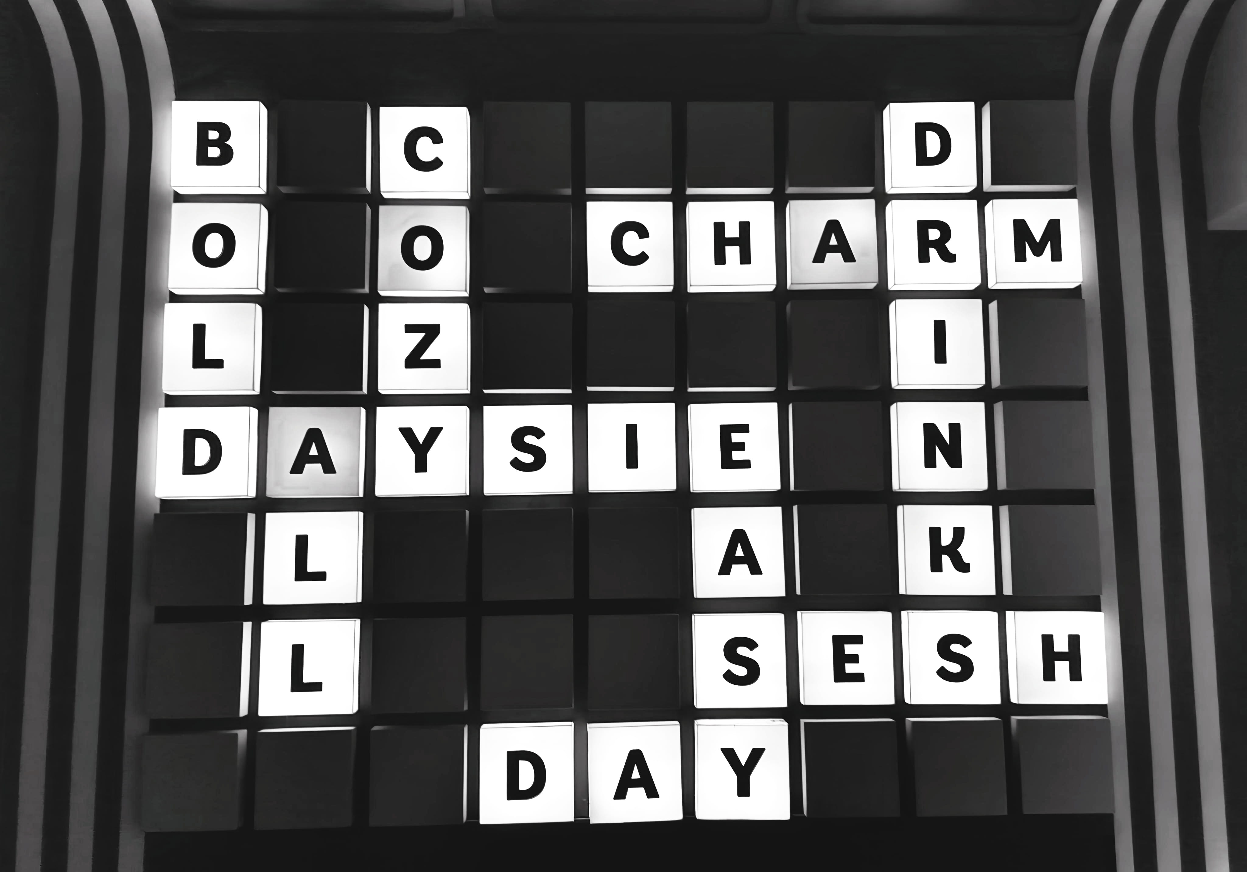 A crossword-style illuminated letter board spelling Daysie, Charm, Drink, Cozy, and other words
